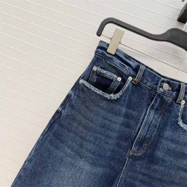S3a3609bd86e443c5887f303e9ae3970bU.webp Jean femme nouveau modèle taille haute coupe slim pour l’été 2026, pantalon coupe droite en coton pur avec effet délavé rétro style Y2K