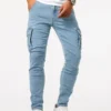 S3d72a5f8be534968beca81425980a704Q.webp Pantalon cargo en denim élastique Street Jeans pour homme, coupe slim, couleur unie, plusieurs poches, style décontracté, taille mi-haute, idéal au quotidien.