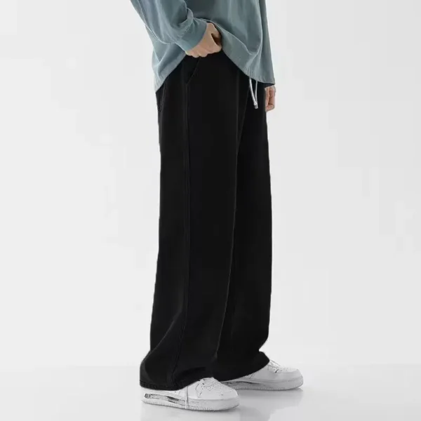 Jeans longs décontractés pour homme, coupe classique, jambes larges.