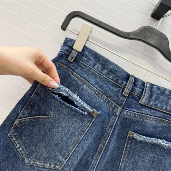 Sc11958fbac524d358f5267719298cee1D.webp Jean femme nouveau modèle taille haute coupe slim pour l’été 2026, pantalon coupe droite en coton pur avec effet délavé rétro style Y2K