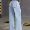 Scbf93f19b8884f9ebc7a5beb13e9cae6m.webp Jeans pour femme style années 2000, pantalon en denim bleu clair à jambes larges, coupe ample, mode simple et extensible, idéal en toutes saisons et décontracté.
