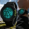 Montre numérique unisexe à grand cadran, éclairage LED, étanche, bracelet en caoutchouc, alarme, noire.