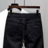 Jeans déchirés style streetwear Kpop Y2K pour homme, imprimé pois tendance, short en jean noir boyfriend décontracté et usé.