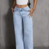 Sf9be3054cd8b45cd80dcd9eed5798253i.webp Jeans pour femme style années 2000, pantalon en denim bleu clair à jambes larges, coupe ample, mode simple et extensible, idéal en toutes saisons et décontracté.